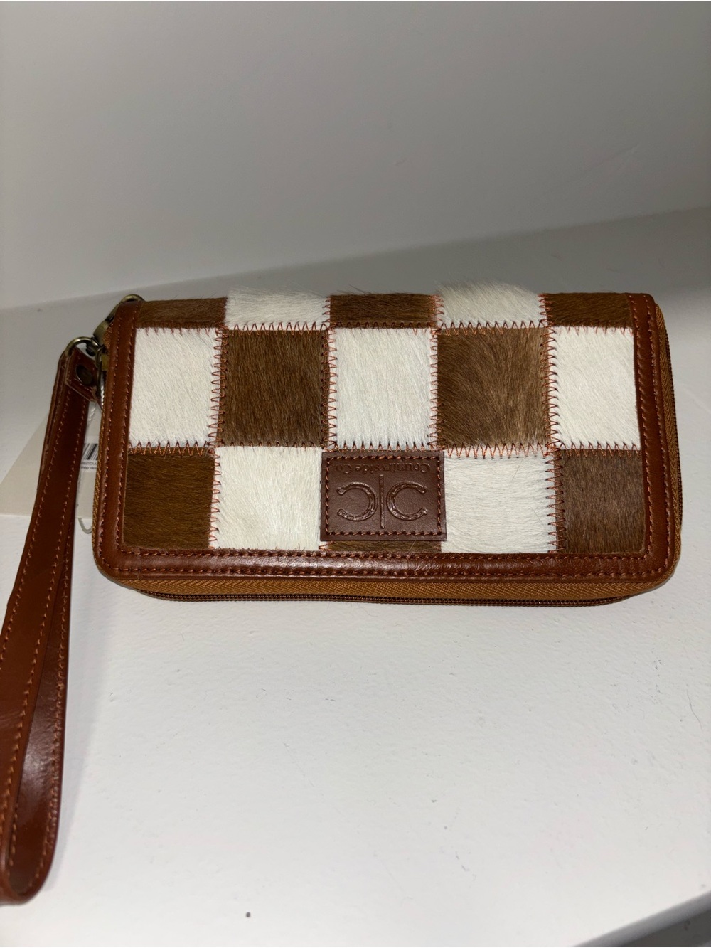 Checker Patch Wristlet wallet in Brown & White faux fur